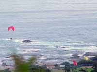 Para Glider crossing Chapman's Peak Road to land on Hout Bay beach