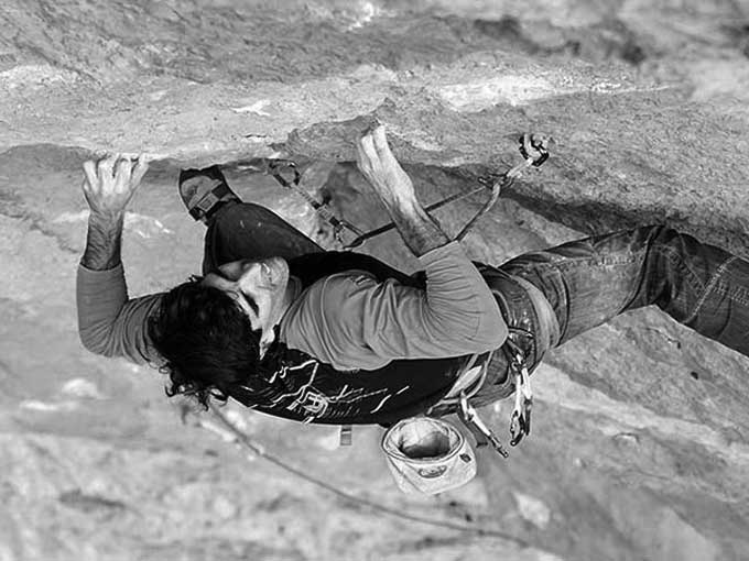 Mountaineer hanging on a clip