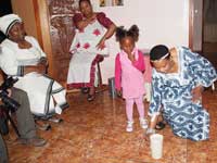 A Tourist Guide and Tour Operator showing the art of african traditional beer making