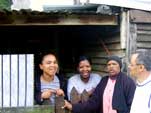 Dwellers in front of their home in Hangberg, Hout Bay